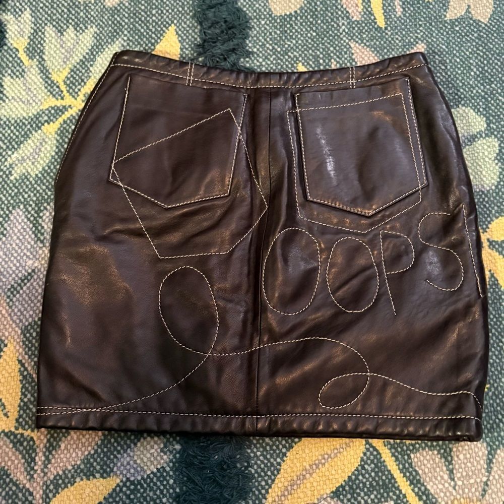MOSCHINO leather mini skirt - embroidery “oops” and hearts - approx size 2